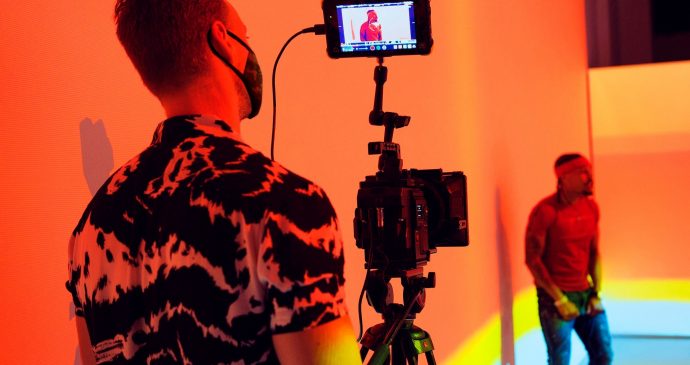 Camera man wearing Covid-19 mask